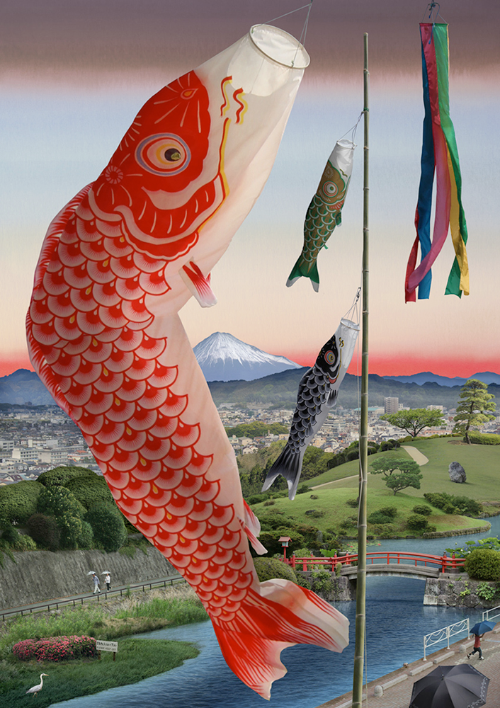 A huge red fish appears to jump out of the water below, along with two smaller fish, one green and one black. They are in fact banners attached to a flag pole. Below them is Tokyo and beyond is Mount Fuji.
