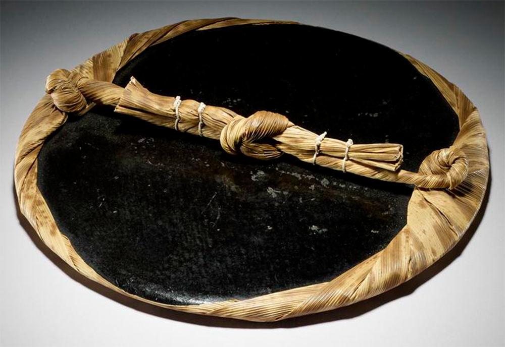 Circular printers pad consisting of a coil of bamboo twine faced with lacquered paper, and wrapped in bamboo bark.