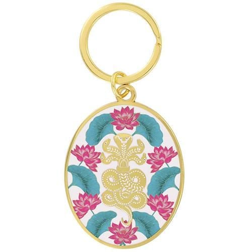 A gold-coloured keyring decorated with a five-headed snake surrounded by lotus flowers