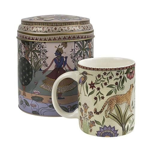 A tin and mug with ornate traditional Indian decoration