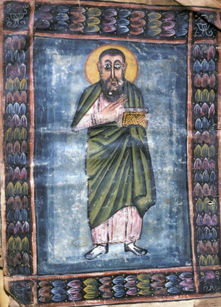 A painting of a Holy Man wearing green robes. Border of colourful motifs. 